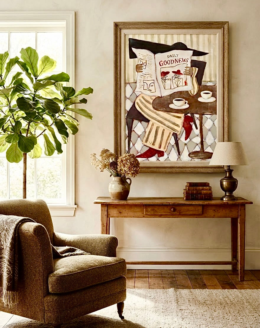 Affiche Daily Good News encadrée et accrochée au mur d'un salon